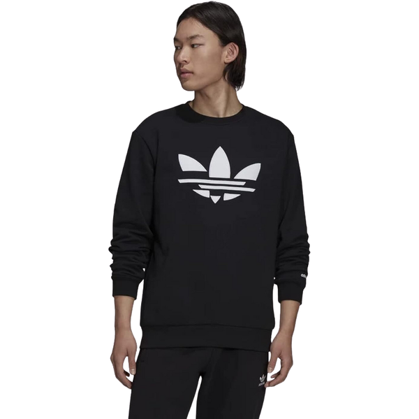 Man sporting the adidas Originals ST Crew Sweatshirt with a revamped Trefoil logo