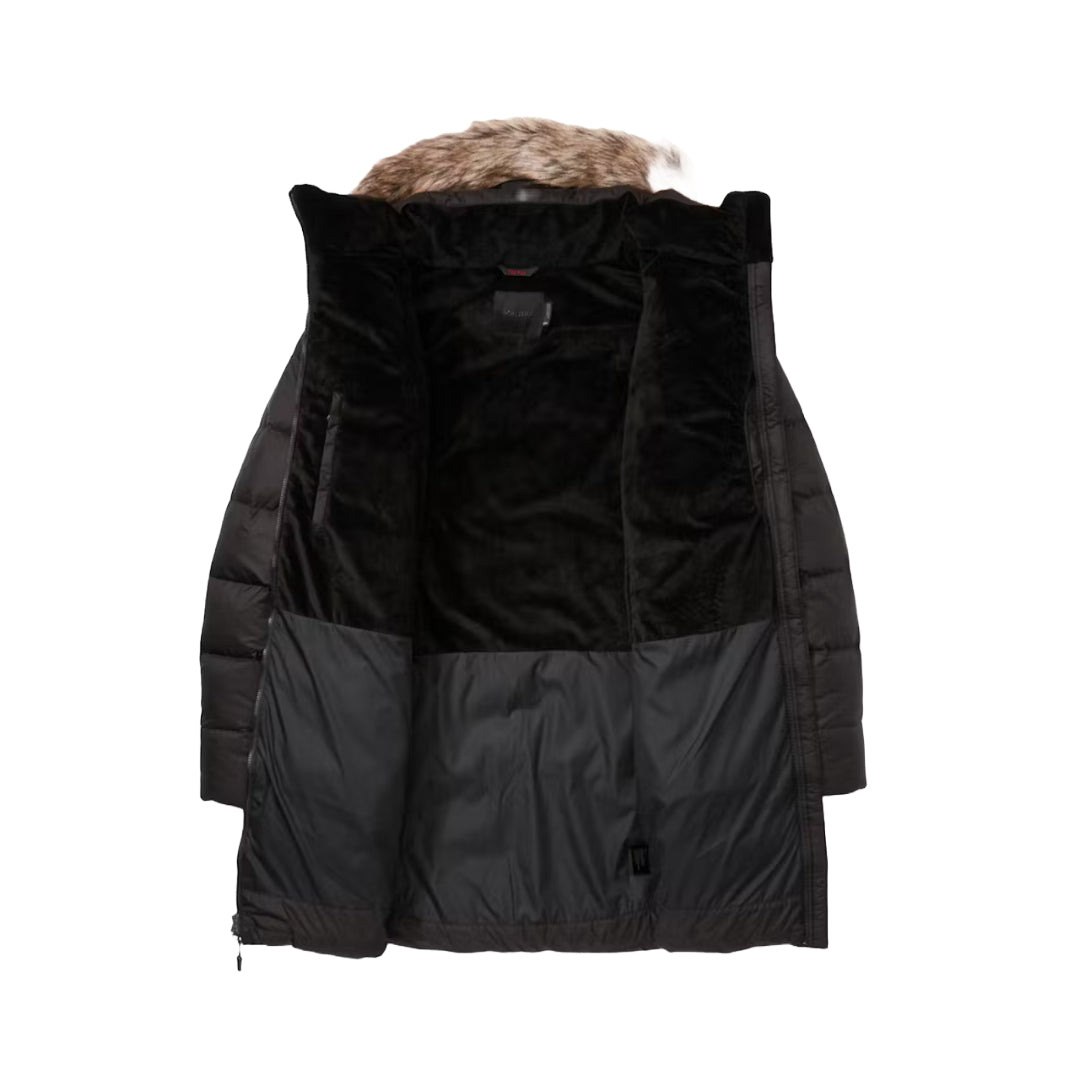 Marmot Women's Montreal Plus Size Mid-Thigh Down Puffer Coat in classic black, designed for superior warmth and comfort during cold-weather adventures.