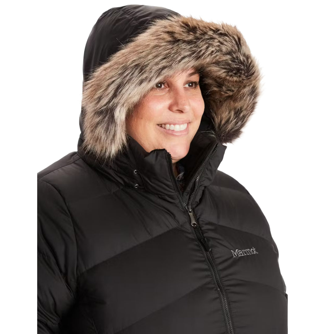 Marmot Women's Montreal Plus Size Mid-Thigh Down Puffer Coat in classic black, designed for superior warmth and comfort during cold-weather adventures.