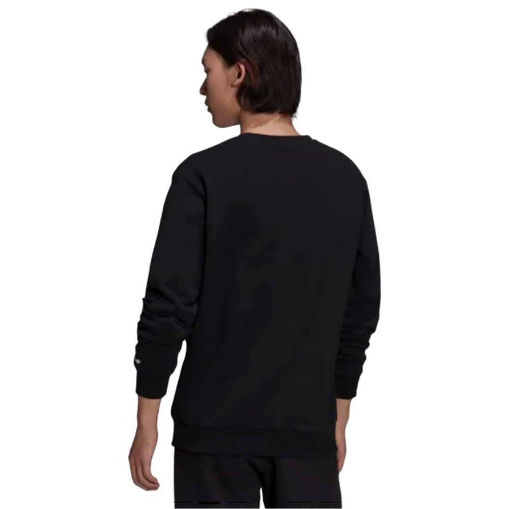 Man sporting the adidas Originals ST Crew Sweatshirt with a revamped Trefoil logo