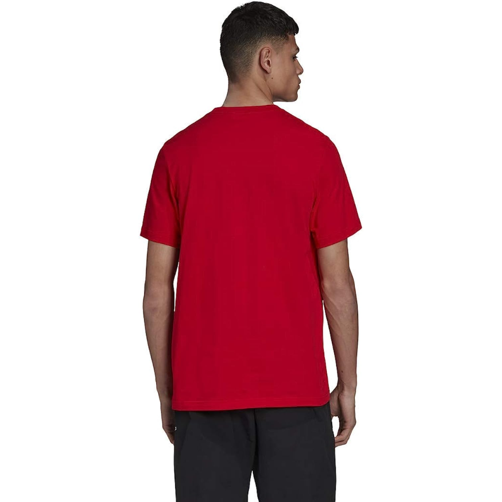 Man wearing adidas Originals Men's Trefoil Essential Tee in Scarlet