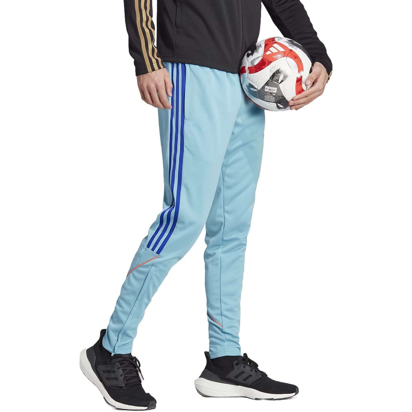 Adidas Men's Tiro Track Pants in Preloved Blue/Lucid Blue with white stripes down the sides and Adidas logo on the left thigh