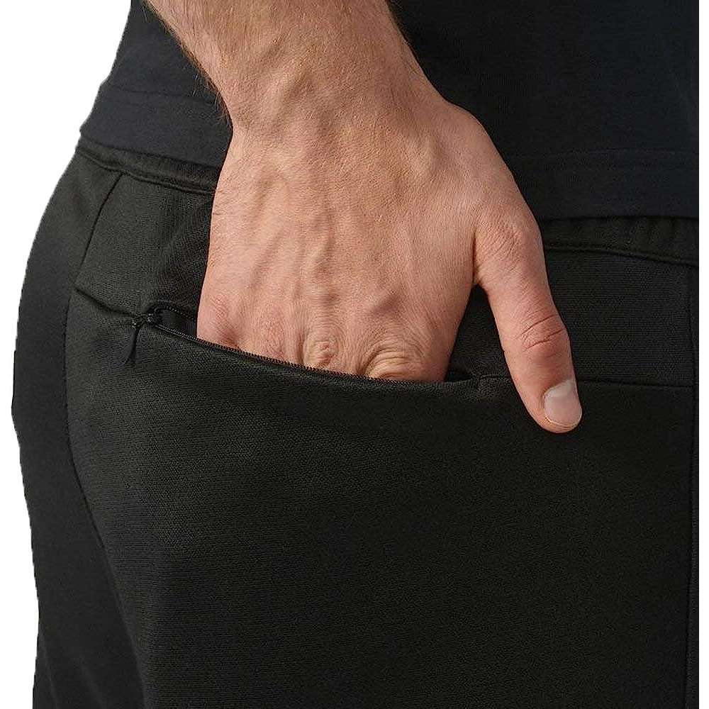 A man wearing adidas Men's Originals BLK/WVN T90 TIRO Track Pants
