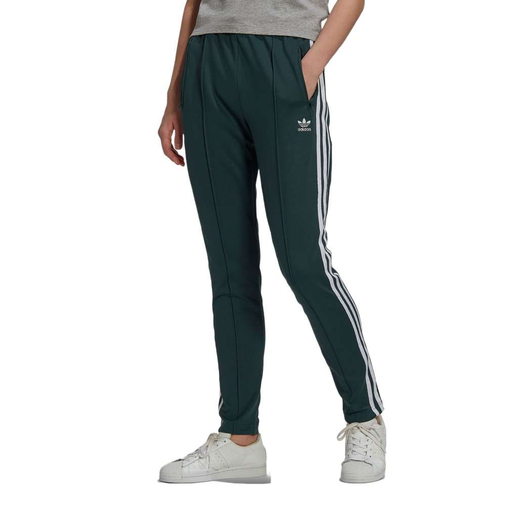 A woman wearing the adidas Originals Women's Primeblue Superstar Track Pants