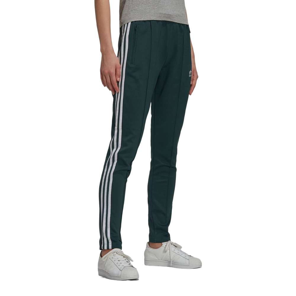A woman wearing the adidas Originals Women's Primeblue Superstar Track Pants