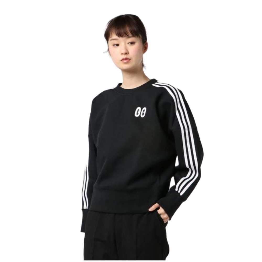 A woman wearing adidas Women's Originals Crewneck Sweatshirt