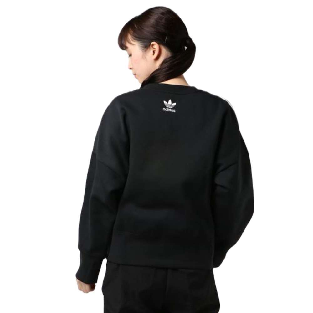 A woman wearing adidas Women's Originals Crewneck Sweatshirt