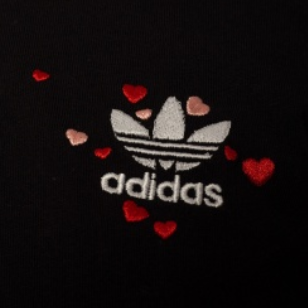 Embrace the sporting lifestyle with the adidas Originals Women's SS Black Cropped T-Shirt. With embroidered logo and decorative drawstrings, shop at Runnwalk.com.