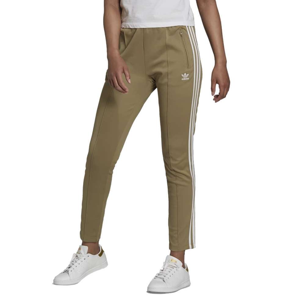 A woman wearing the adidas Originals Women's Primeblue Superstar Track Pants