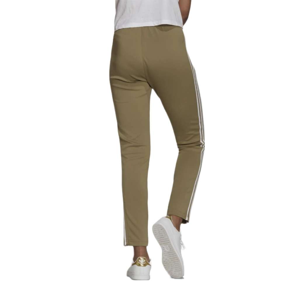 A woman wearing the adidas Originals Women's Primeblue Superstar Track Pants