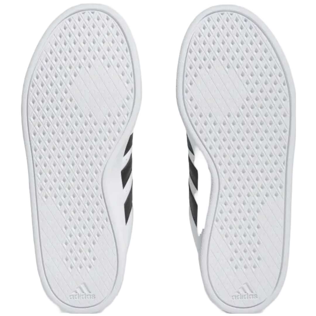 A pair of adidas Breaknet 2.0 sneakers for women in white with black strips. The sneakers feature a leather and synthetic upper, a rubber outsole, and the adidas logo on the side.