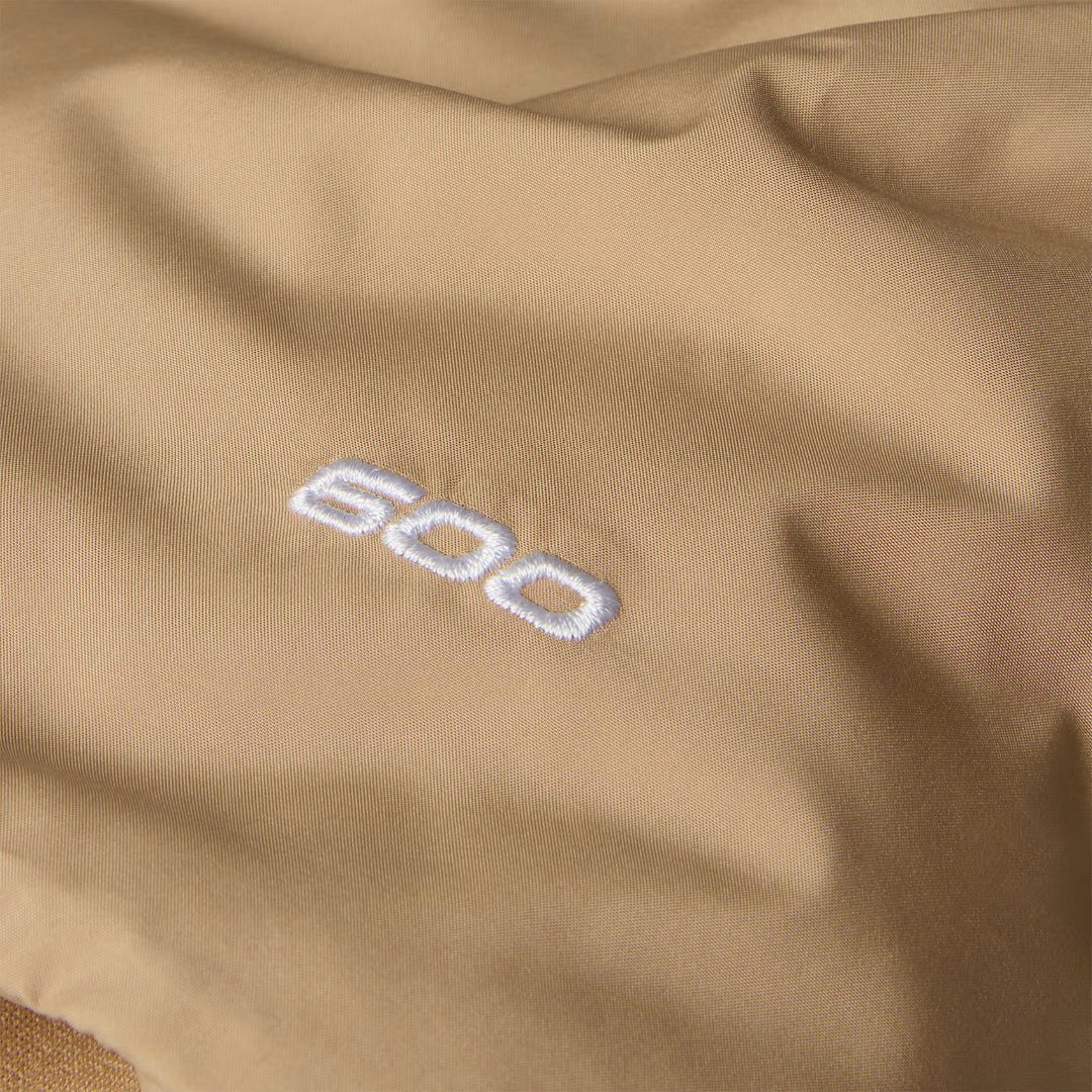 The North Face Women's Triple C Parka, long insulated winter coat with down fill, designed for warmth and style in cold weather.