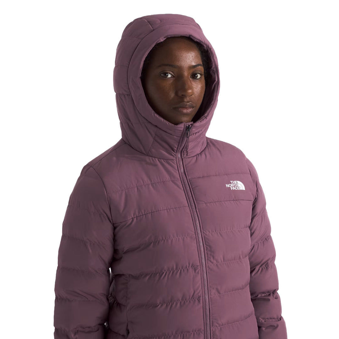 The North Face Women's Aconcagua Parka, insulated with down and synthetic fill, offering lightweight warmth and water-repellent protection
