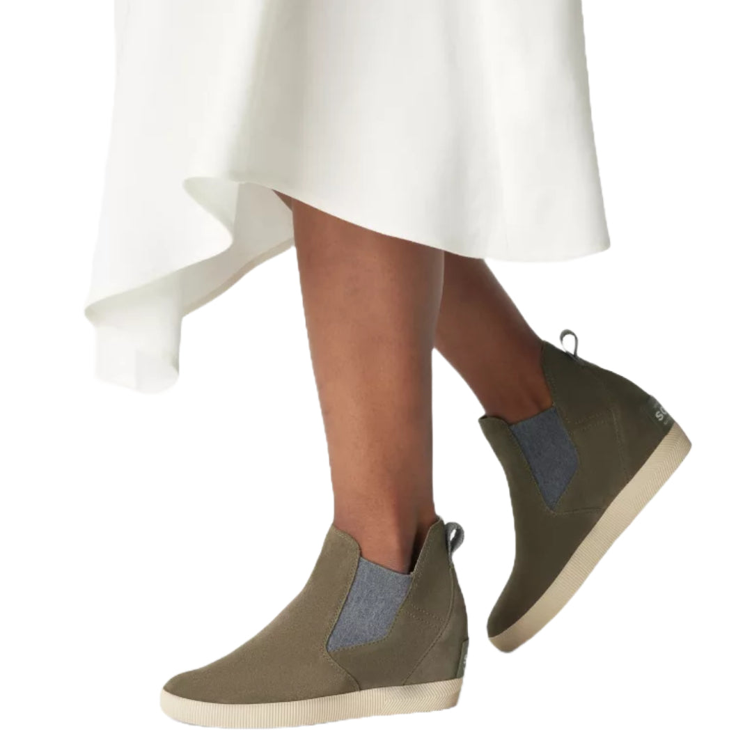Sorel Women's Out N About Slip-On Wedge Boot in black with a stylish design and comfortable fit.