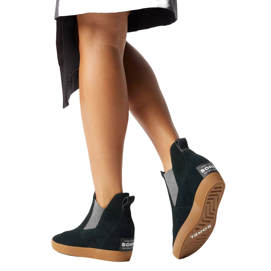 Sorel Women's Out N About Slip-On Wedge Boot in black with a stylish design and comfortable fit.