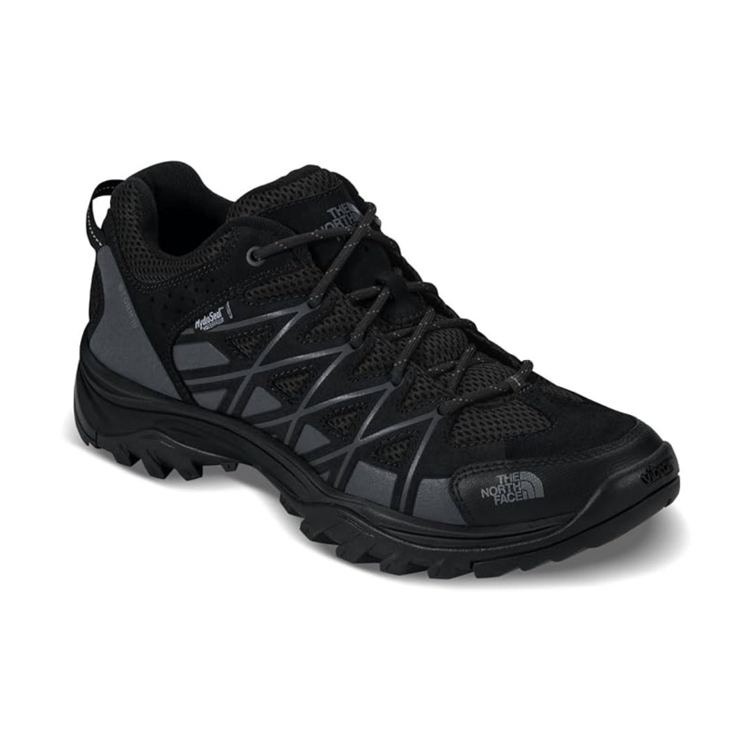 Men's waterproof hiking shoe featuring a leather and synthetic upper, lace-up closure, reinforced toe cap, padded collar, cushioned EVA midsole, and a durable rubber outsole with aggressive multi-directional lugs for hiking and outdoor adventures