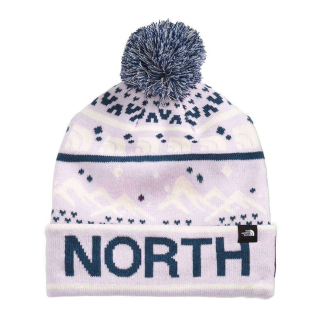The North Face Ski Tuke Pom Hat featuring color-block knit design, fold-over cuff, embroidered logo patch, and pom detail for winter warmth.