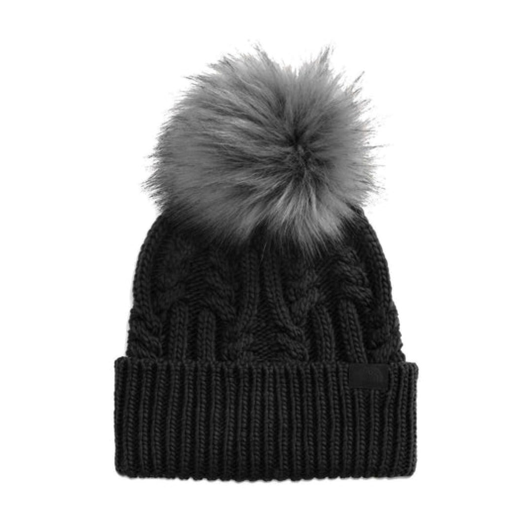 The North Face Women’s Oh Mega Fur Pom Beanie featuring soft knit fabric, fold-over cuff, and plush faux-fur pom on top for cozy winter style.