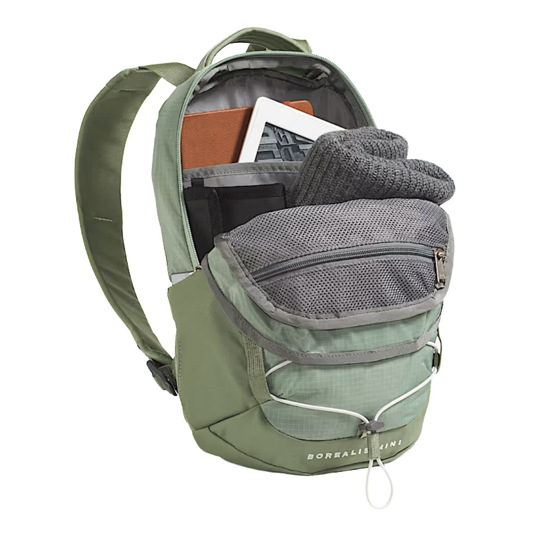 The North Face Borealis Mini Backpack in black with bungee cord detailing and compact, structured silhouette.