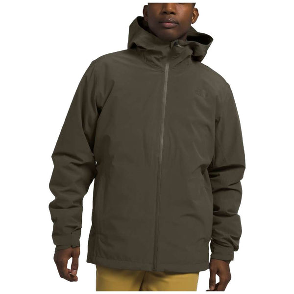 A man wearing The North Face Men’s ThermoBall™ Eco Triclimate® Jacket in taupe green, braving the elements.