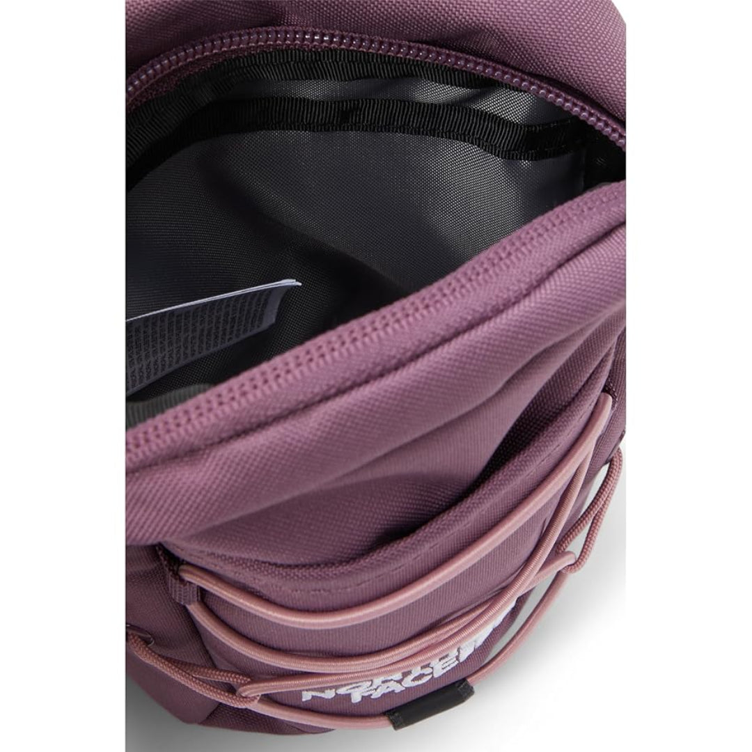 The North Face Jester Crossbody in black, featuring a compact design with multiple compartments and an adjustable strap.