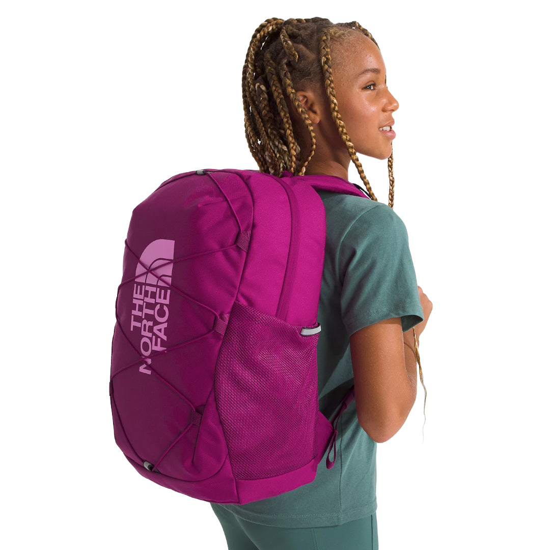 The North Face Youth Court Jester Backpack in blue, featuring a spacious main compartment, front bungee system, and padded shoulder straps.