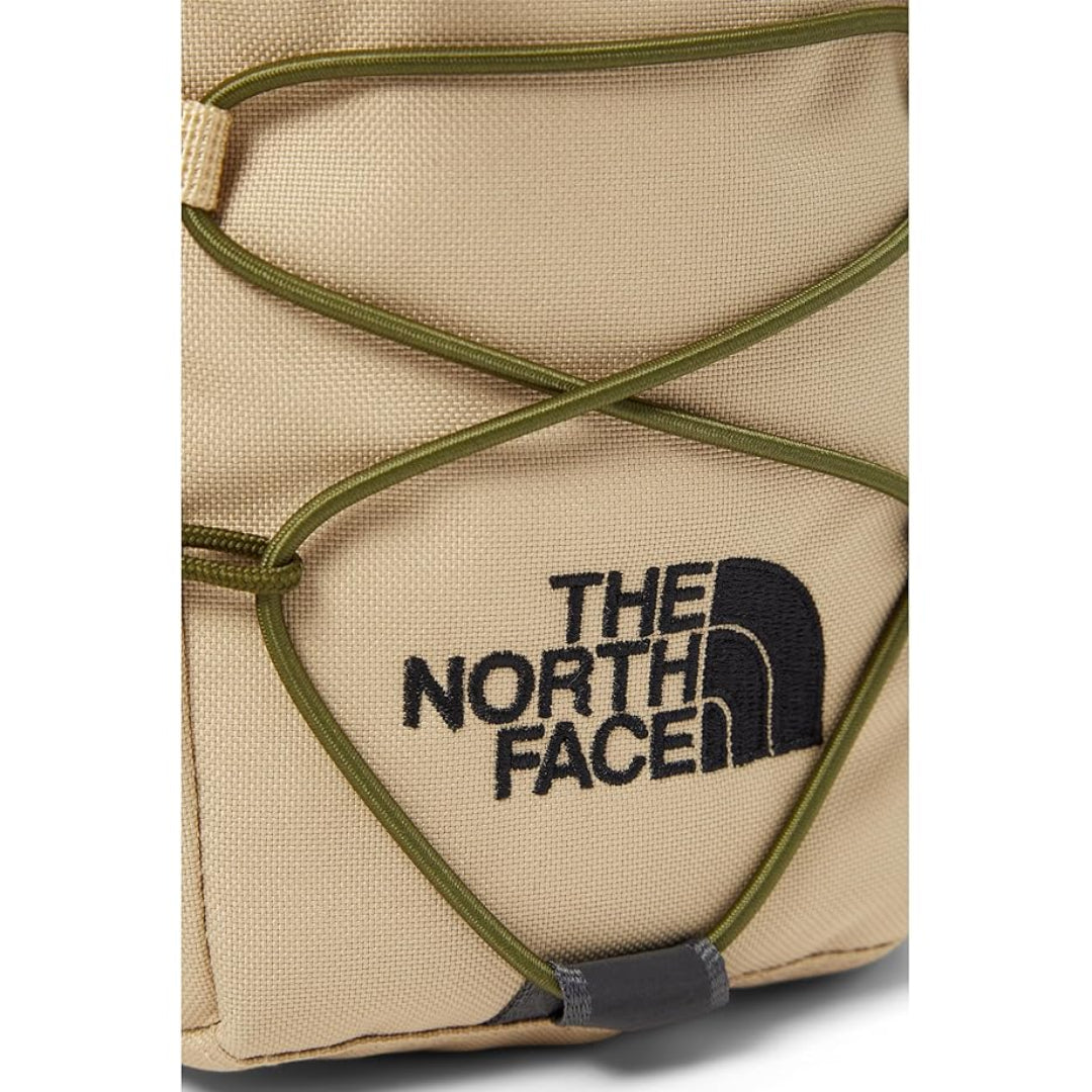 The North Face Jester Crossbody in black, featuring a compact design with multiple compartments and an adjustable strap.