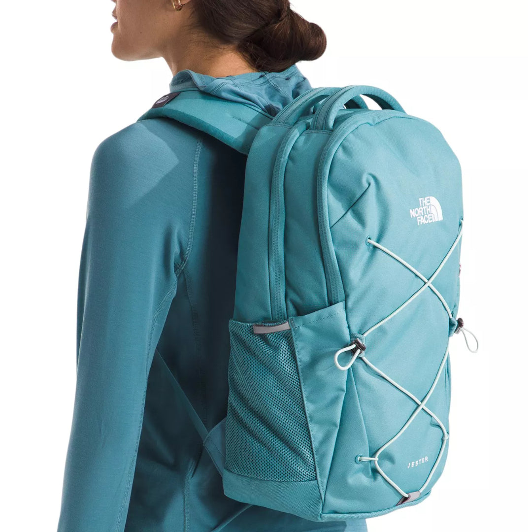The North Face Women's Jester Backpack in black, featuring a women-specific design, spacious compartments, and adjustable shoulder straps.