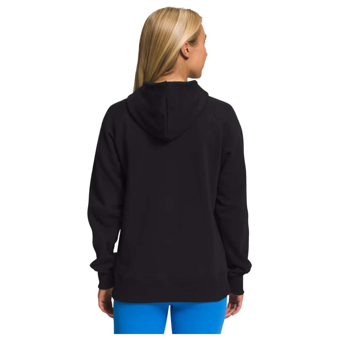 A close-up of the North Face Women's Half Dome Pullover Hoodie in classic black, showcasing the iconic logo and comfortable design.
