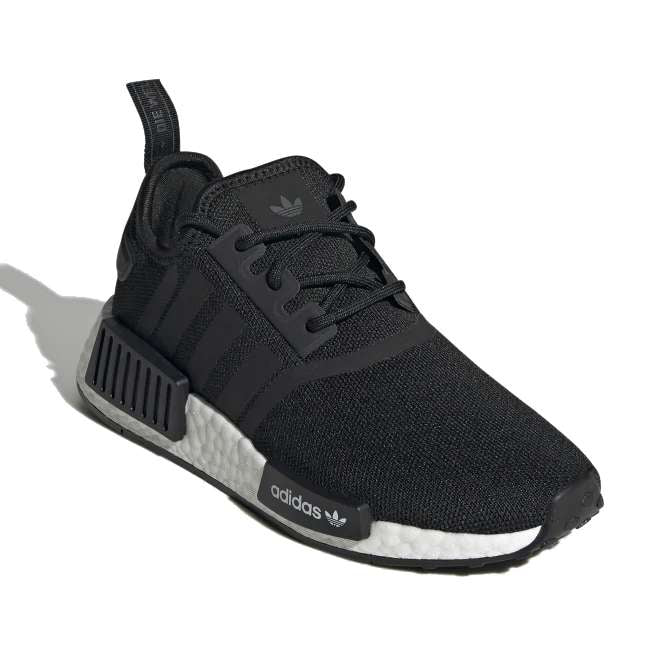 A pair of black adidas Originals Junior NMD_R1 shoes with white detailing.