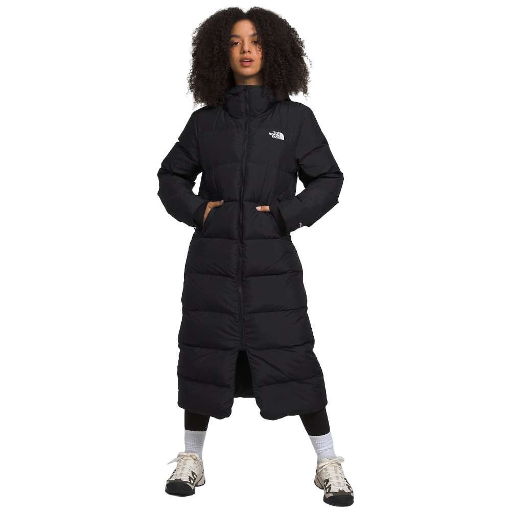 A sleek black north face women's triple c parka worn by women.