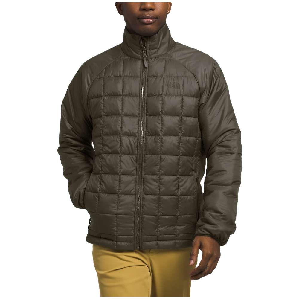 A man wearing The North Face Men’s ThermoBall™ Eco Triclimate® Jacket in taupe green, braving the elements.
