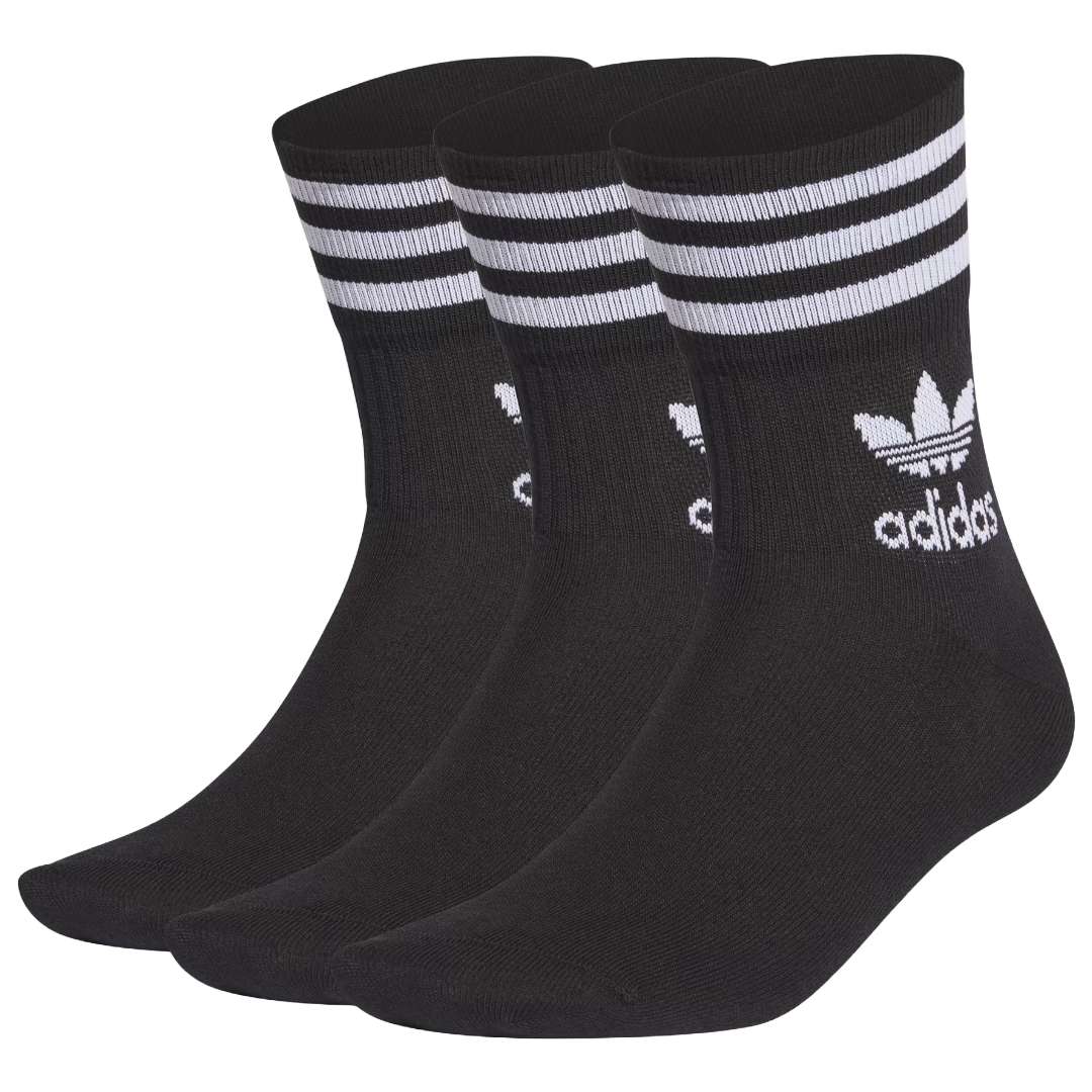 A close-up view of adidas Originals MID Cut Crew Socks in black and white.