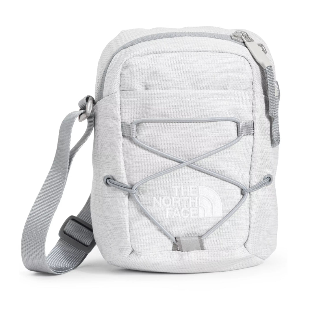 The North Face Jester Crossbody in black, featuring a compact design with multiple compartments and an adjustable strap.