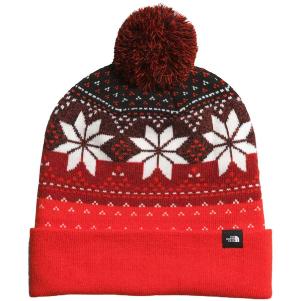 A striking North Face Ski Tuke in Fiery Red/TNF Black, ready for winter adventures.