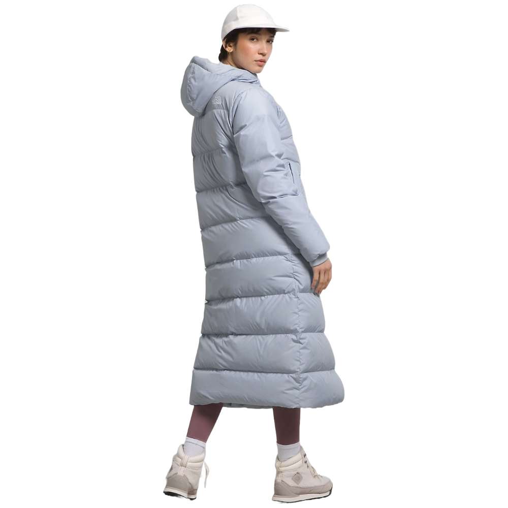 A dusty Periwinkl north face women's triple c parka worn by women.