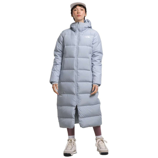 A dusty Periwinkl north face women's triple c parka worn by women.
