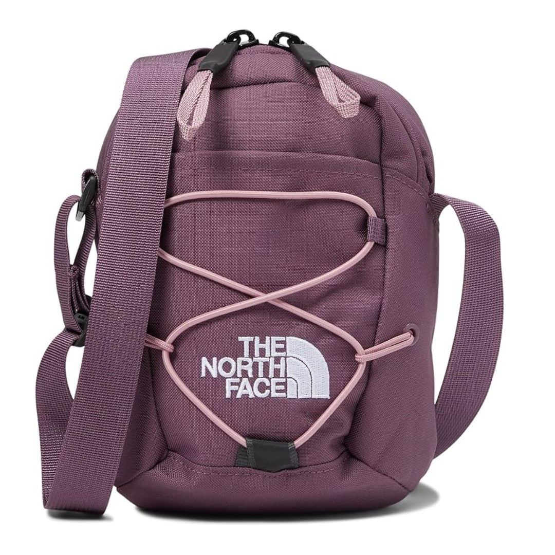 The North Face Jester Crossbody in black, featuring a compact design with multiple compartments and an adjustable strap.
