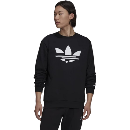 Man sporting the adidas Originals ST Crew Sweatshirt with a revamped Trefoil logo