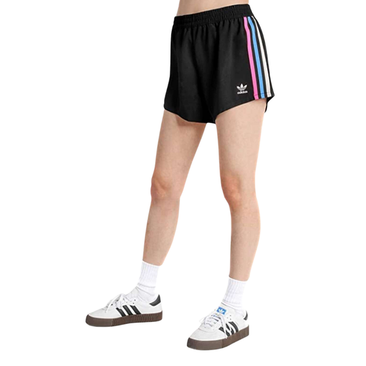 Woman flaunting the adidas Originals Women's Tricolor 3-Stripes Shorts