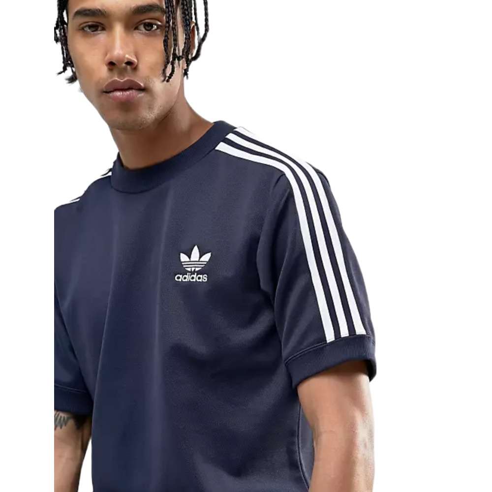 A man wearing adidas Men Originals CNTP SS Crew Tee