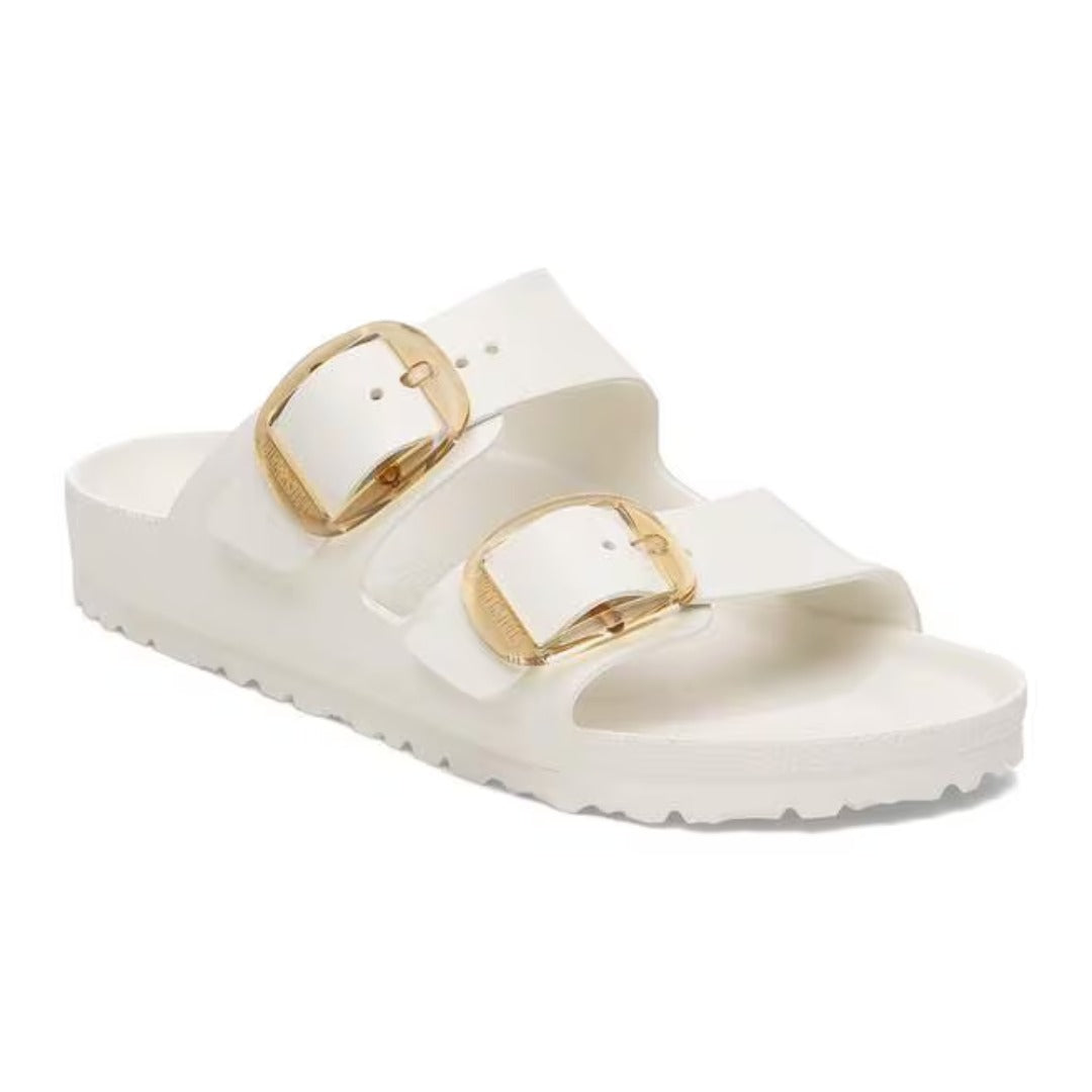 Two-strap sandal featuring oversized adjustable metal buckles, a contoured cork-latex footbed, and an open-toe design for stylish everyday comfort