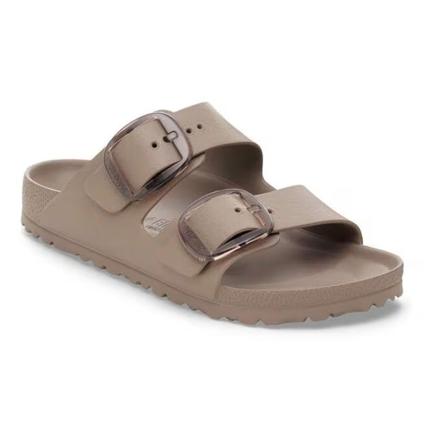 Two-strap sandal featuring oversized adjustable metal buckles, a contoured cork-latex footbed, and an open-toe design for stylish everyday comfort