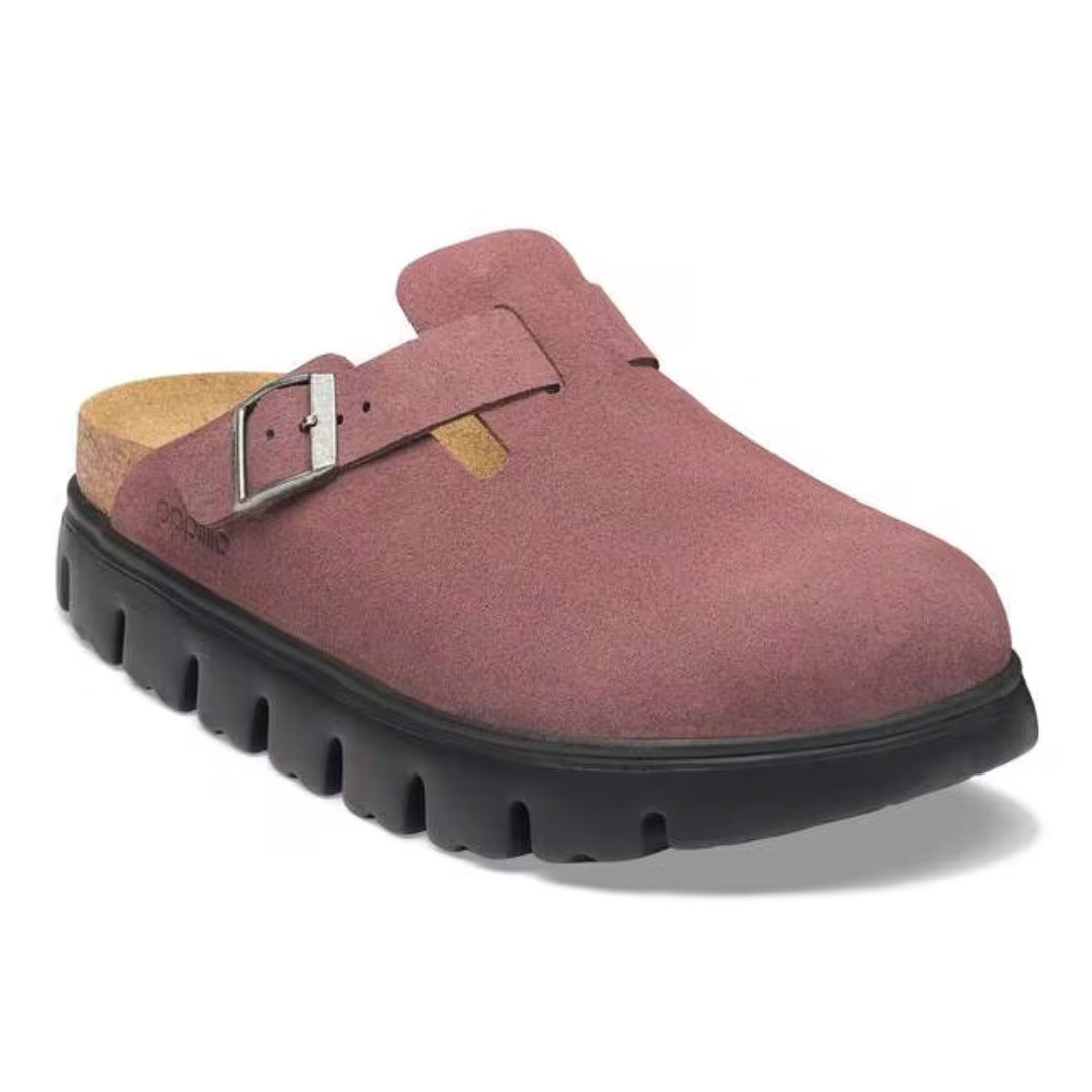 Chunky platform clog featuring a closed-toe design, adjustable buckle strap, contoured footbed, and elevated sole for modern everyday comfort and style