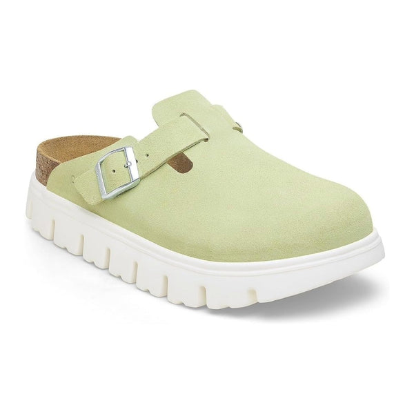 Chunky platform clog featuring a closed-toe design, adjustable buckle strap, contoured footbed, and elevated sole for modern everyday comfort and style