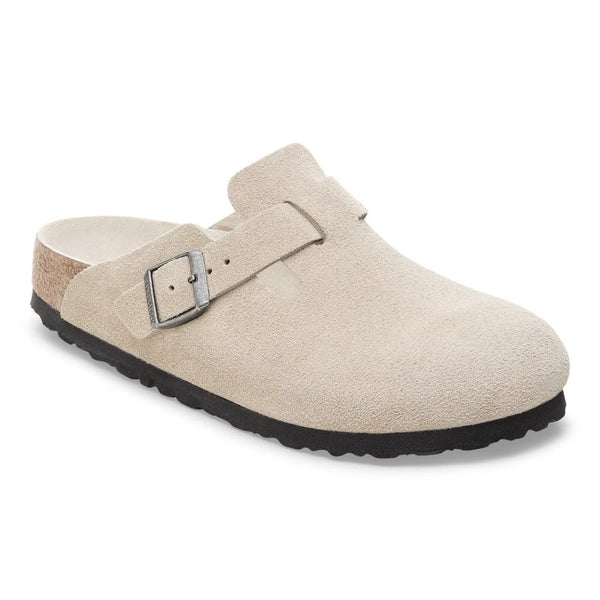 Women wearing Birkenstock Boston Soft Footbed clogs, closed-toe suede slip-on shoes with buckle strap and cushioned cork footbed, styled for casual everyday wear.