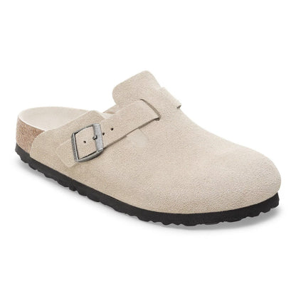 Women wearing Birkenstock Boston Soft Footbed clogs, closed-toe suede slip-on shoes with buckle strap and cushioned cork footbed, styled for casual everyday wear.