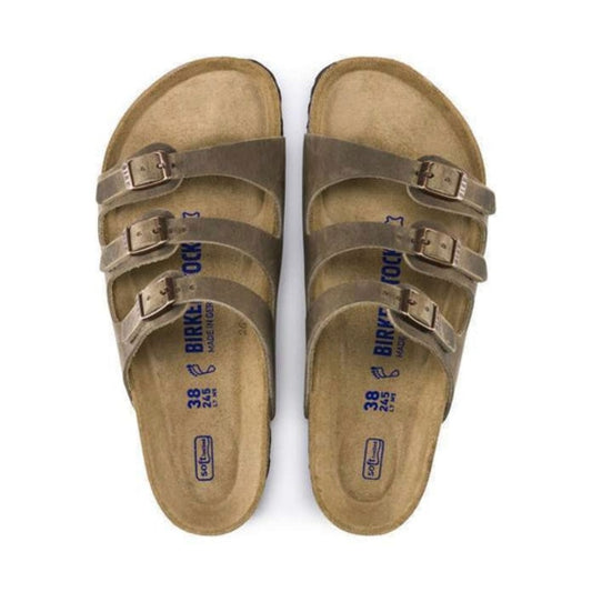 Three-strap sandal featuring a cushioned soft footbed, adjustable buckles, contoured cork-latex support, and a lightweight design for everyday comfort and warm-weather wear