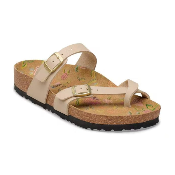 Birkenstock Mayari sandals with toe-loop design and adjustable straps, featuring a contoured cork footbed, worn casually for comfortable everyday style.