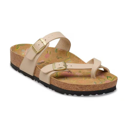 Birkenstock Mayari sandals with toe-loop design and adjustable straps, featuring a contoured cork footbed, worn casually for comfortable everyday style.